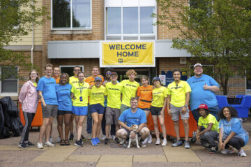 A group of student volunteers posing for a photo during Move-in Day 2023