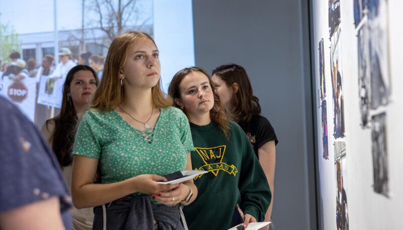 Students looking at the art on the walls