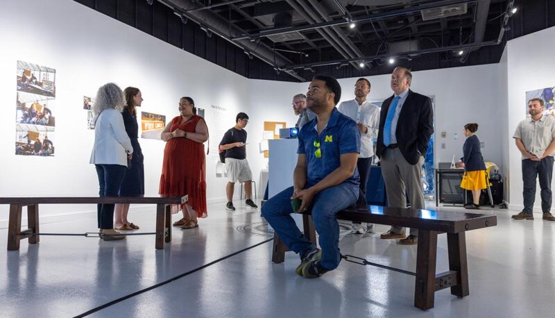 Gallery visitors viewing the "In Search of Memories" gallery.