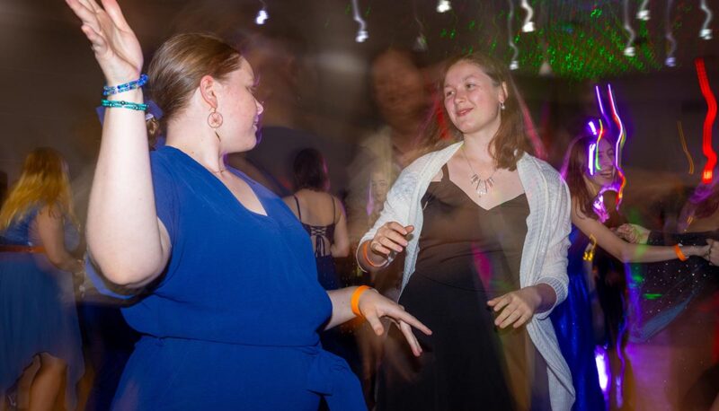 Students dancing during Homecoming in formal attire