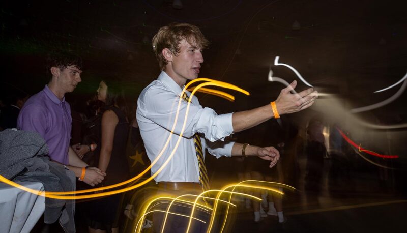 Students dancing during Homecoming in formal attire