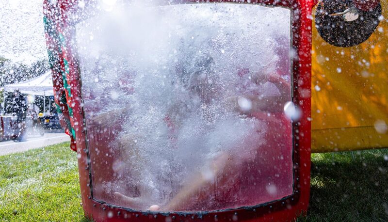 A student getting dropped in a dunk tank.