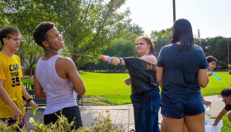 A student being splashed with water.