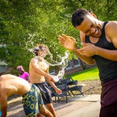 A student being splashed with water.