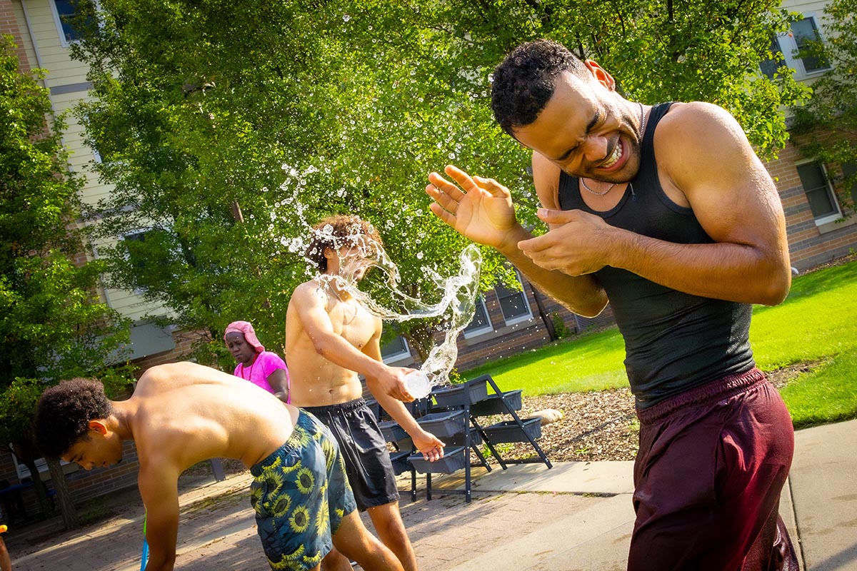 A student being splashed with water.