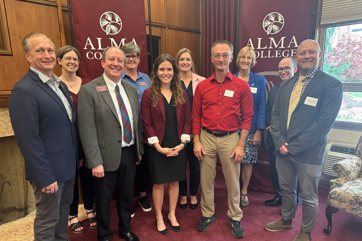 Pictured from left are representatives from Alma College and the University of Michigan-Flint: Tim Pinnow, Nancy Dopke, Sean Burke, Karen Ball, Brianna Harfmann, Julie Jacob, Jeff Turk, Donna Fry, Christopher Lewis and Yener Kandogan.