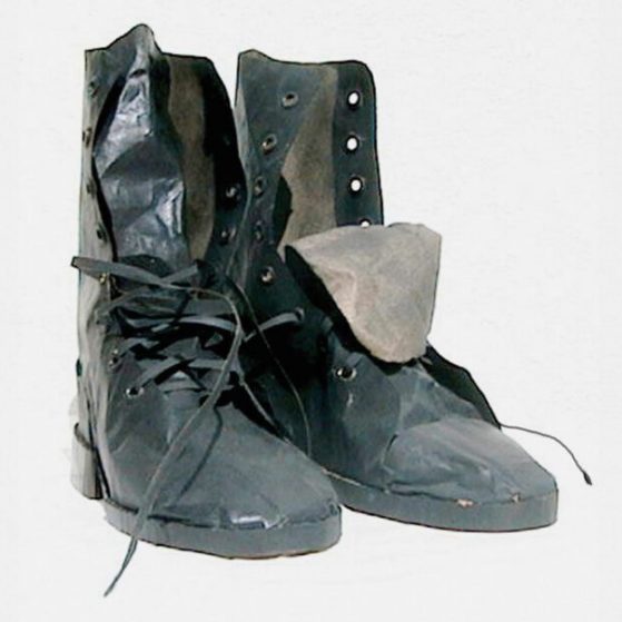 Paper sculpture of black work boots