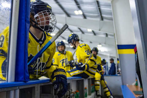 Players entering the bench during a line up change.