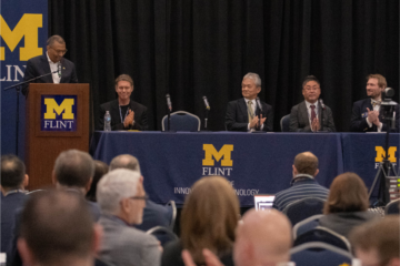 Left to right: Laurence Alexander, UM-Flint chancellor, delivers remarks with Geoffrey Thün, associate vice president for research, social sciences, humanities and the arts at UM-Ann Arbor; Satoshi Hakozaki, CEO of NetSTAR; Yasuaki Arakawa, CTO of NetSTAR; and Jeffrey Yackley, assistant professor of computer science at UM-Flint.