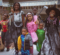 A group of young trick or treaters dressed up in costumes in McKinnon Plaza