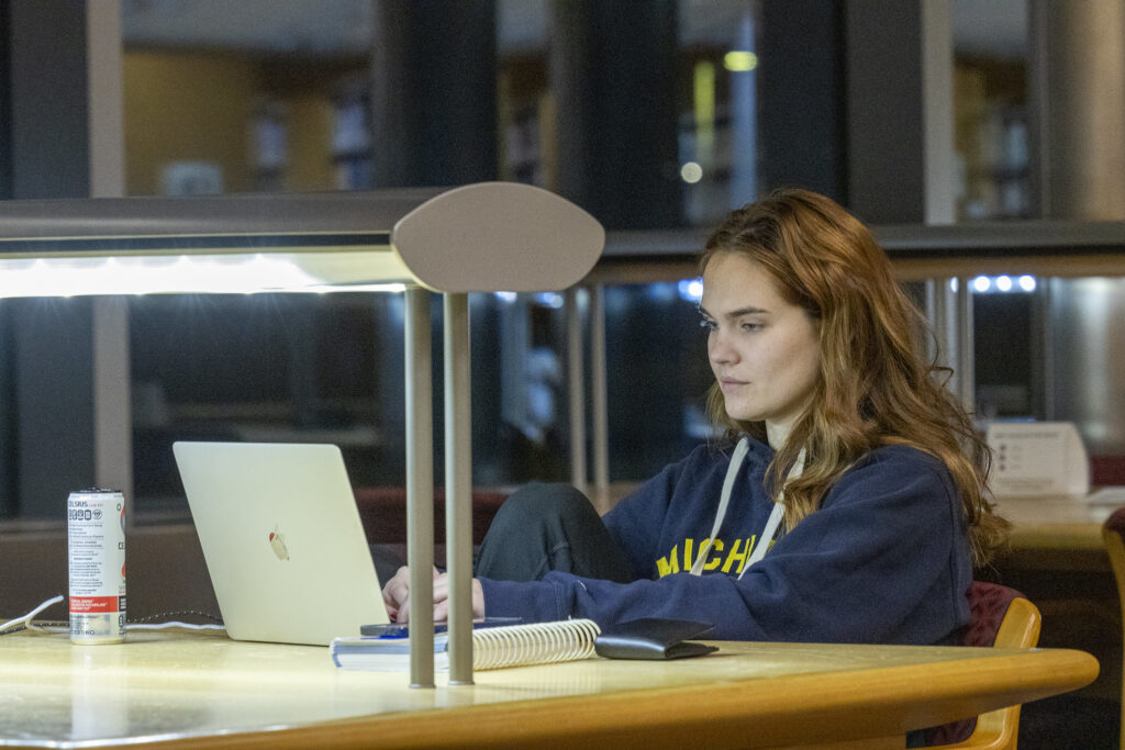 Student studies late into the night for exams.