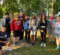 A group of UM-Flint psychology interns posing for the camera with a forest in the background