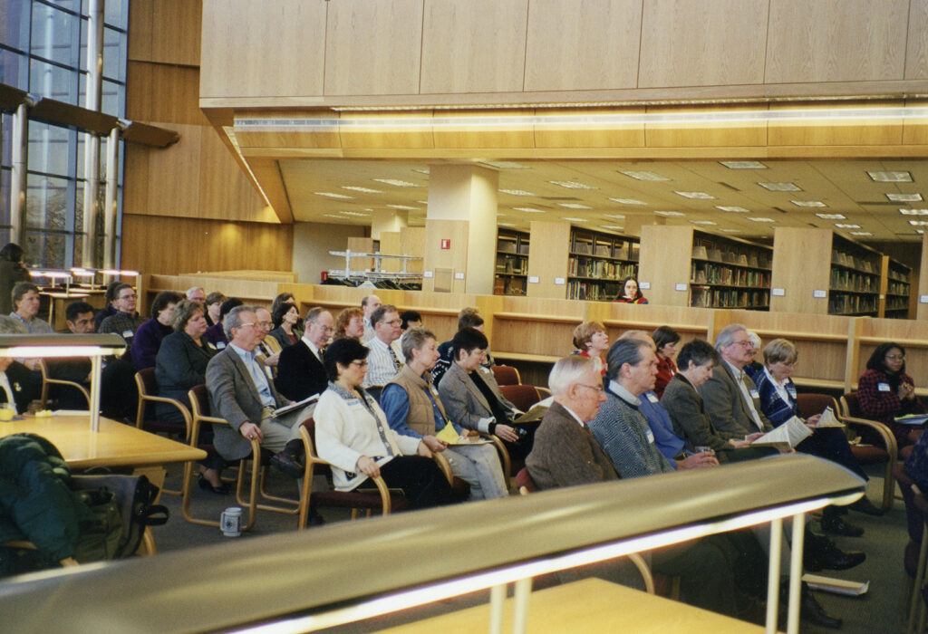 UM-Flint faculty and staff seated in the Library atrium