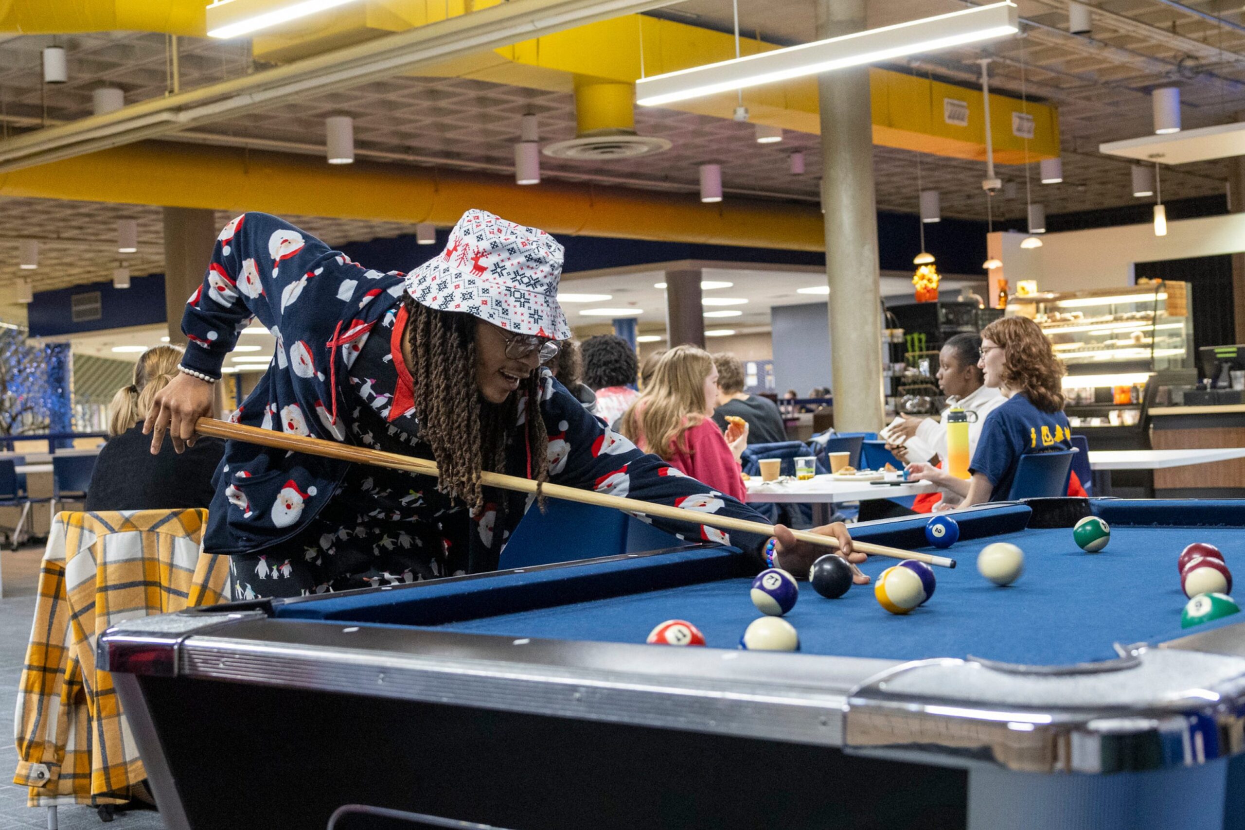 Student playing pool