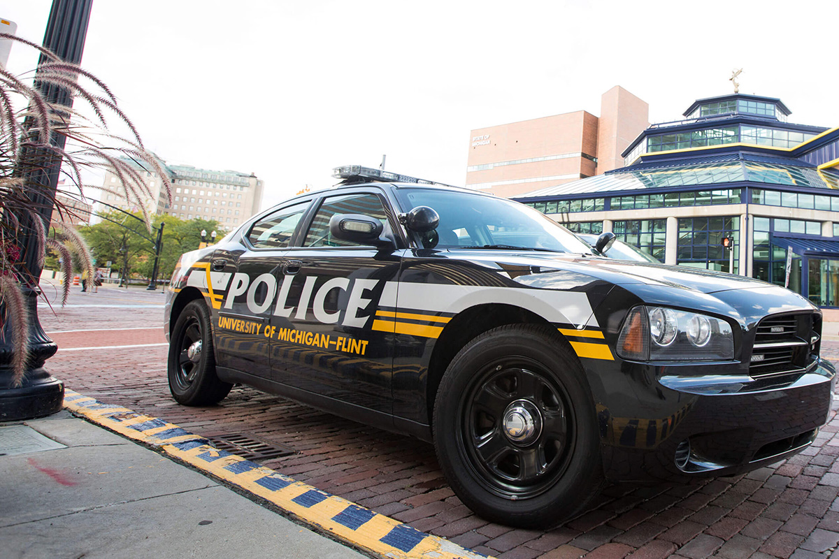 A UM-Flint DPS vehicle parked in front of the UM-Flint Pavilion