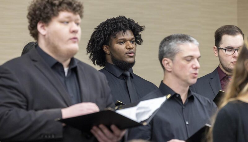 Choir members performing