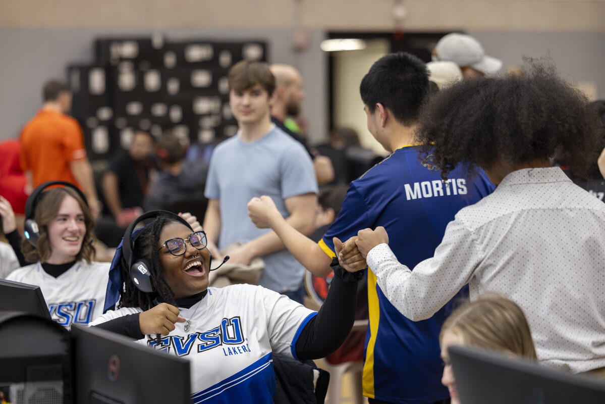 Players share a fist bump in a spirited team moment.