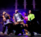 A group of dance performers on stage during an outdoor arts festival in Flint, MI