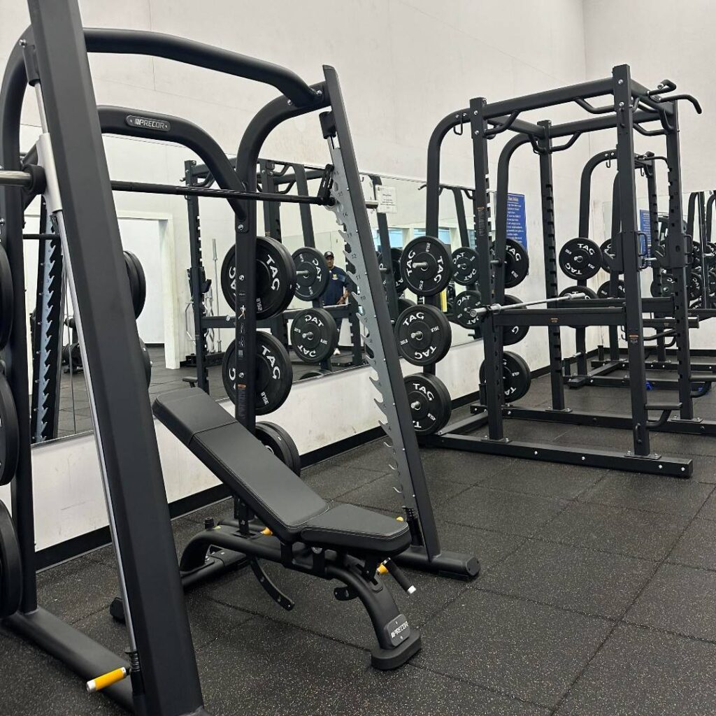 Photo of updated squat rack and free weights.