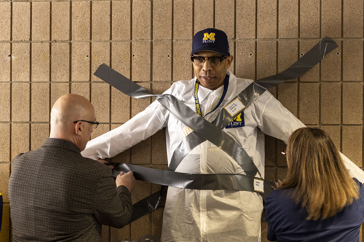 Chancellor Alexander in the beginning stages of being duct taped.