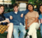 A group of young people sitting together on a couch