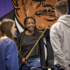 Students enjoy a game of pool during the fall 2024 Late Night Breakfast.