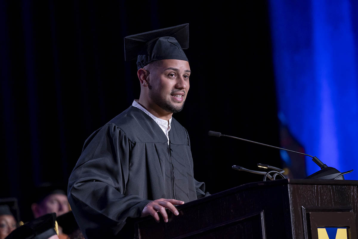 A student speaking on stage.
