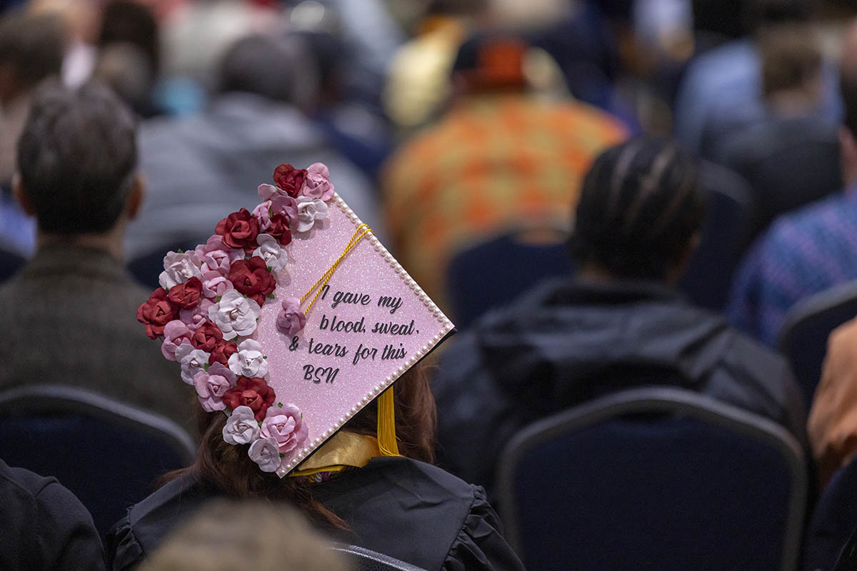 A decorated graduation cap that says "I gave my blood, sweat and tears for this. BSN"