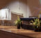 An empty stage at the physician assistant white coat ceremony showcasing a rack of white coats waiting to be distributed.