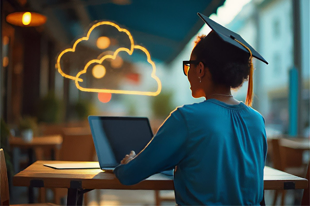 A photo from behind of a young african american woman sitting at a table in a coffee shop. She is wearing a graduation cap and looking at a laptop. there are neon cloud icons above her.