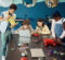 A diverse group of students building a robot with a teacher present.