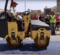 A steamroller rolling over a covered print of art