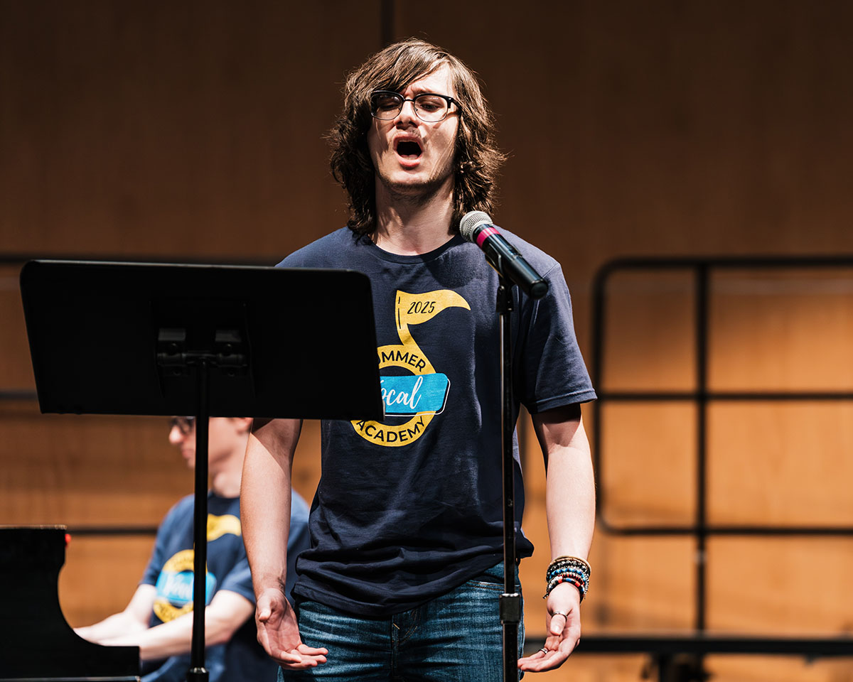 A male vocalist singing during the Summer Vocal Academy of Music