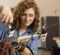Samantha Hunsinger, a female student, waring safety glasses using tools to fix a drone.