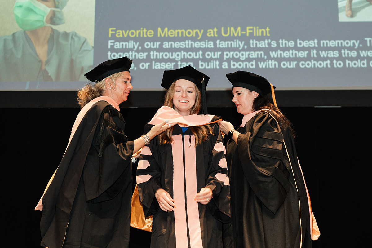 A female DNAP graduate receiving her stole