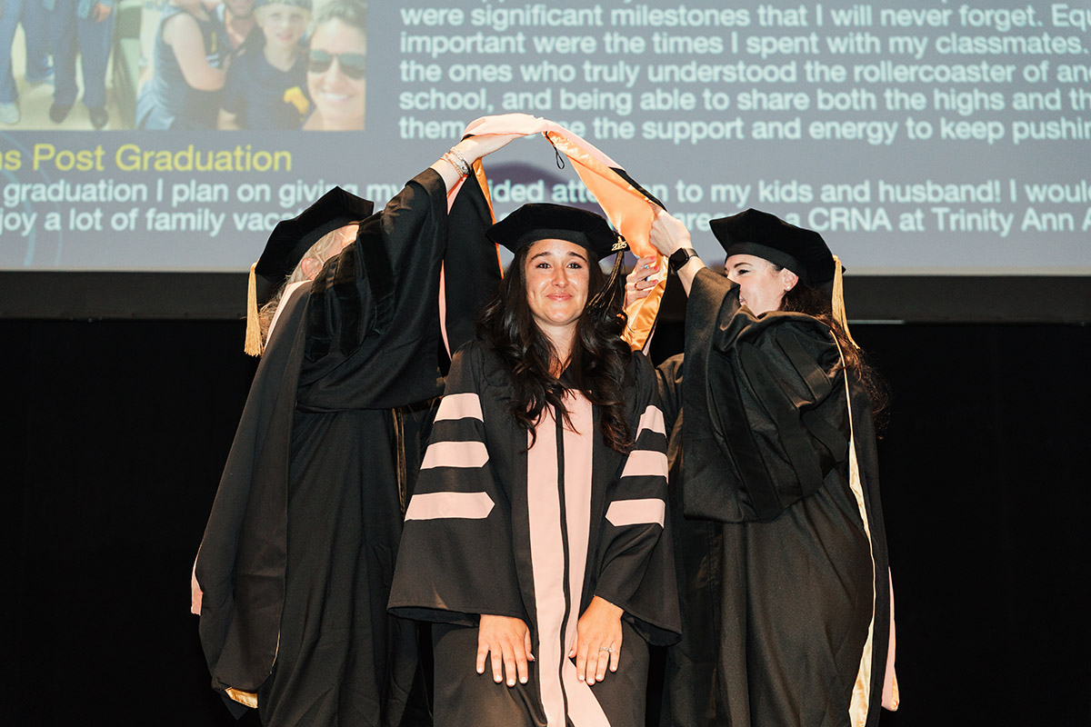 A female DNAP graduate receiving her stole