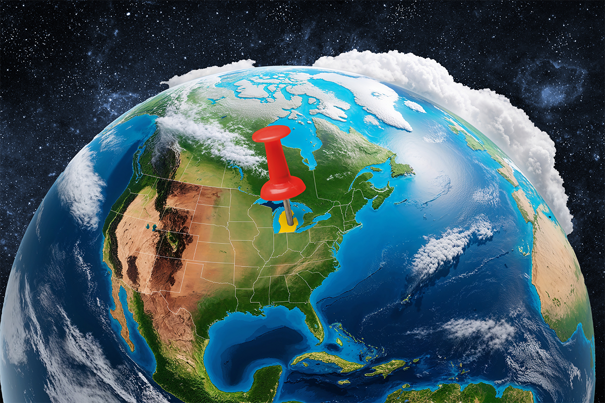 A satellite image of the globe and space focused on North America. A graphic of a map pin is centered on Michigan