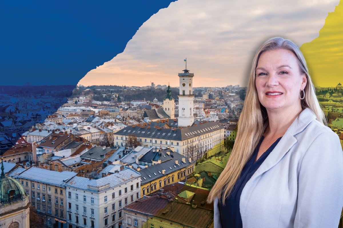 Julie Jacob, Occupational Therapy Director in front of Kviv.