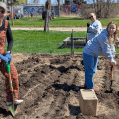 Volunteers help at the Edible Flint garden on Earth Day.