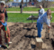 Volunteers help at the Edible Flint garden on Earth Day.