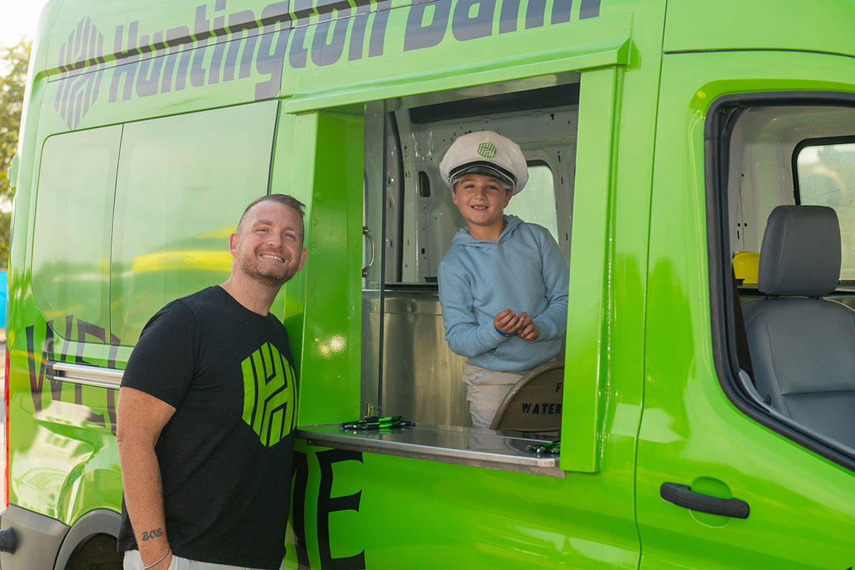 A young boy in a Huntington Bank truck