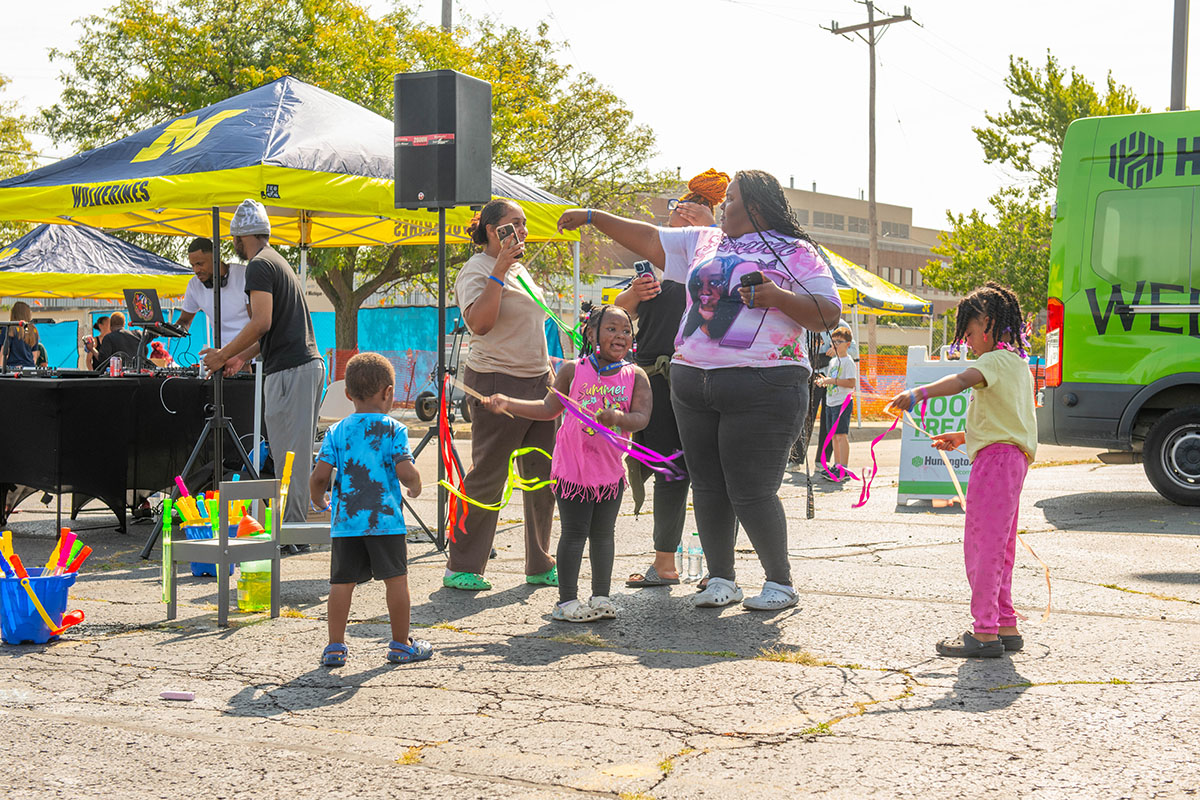 A family dancing with hula hoops
