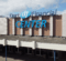 An exterior view of the Dort Financial Center. It shows the large sign on the facade of the building