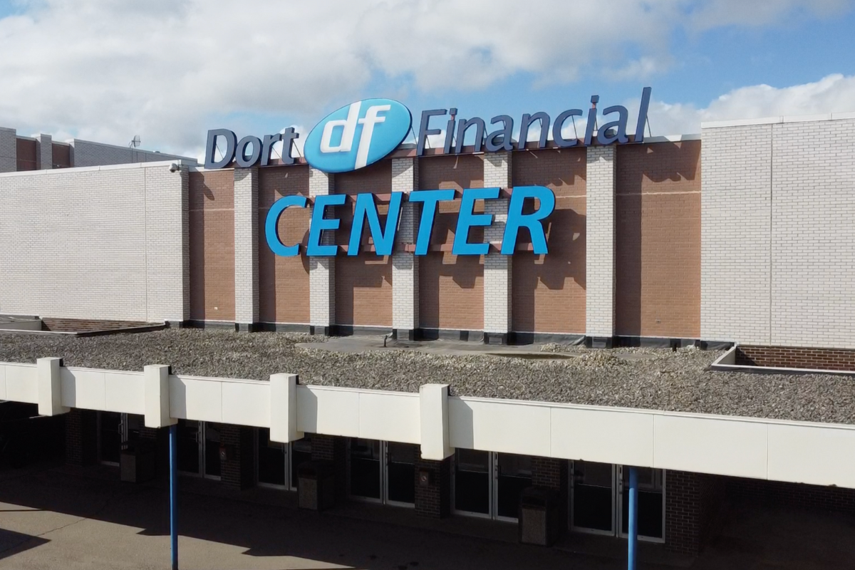 An exterior view of the Dort Financial Center. It shows the large sign on the facade of the building