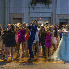 Students in formal wear dancing on the dance floor of the Northbank Ball ROom