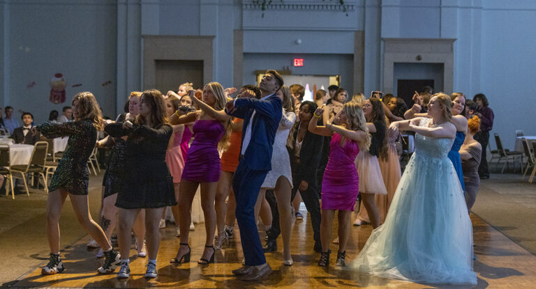 Students in formal wear dancing on the dance floor of the Northbank Ball ROom