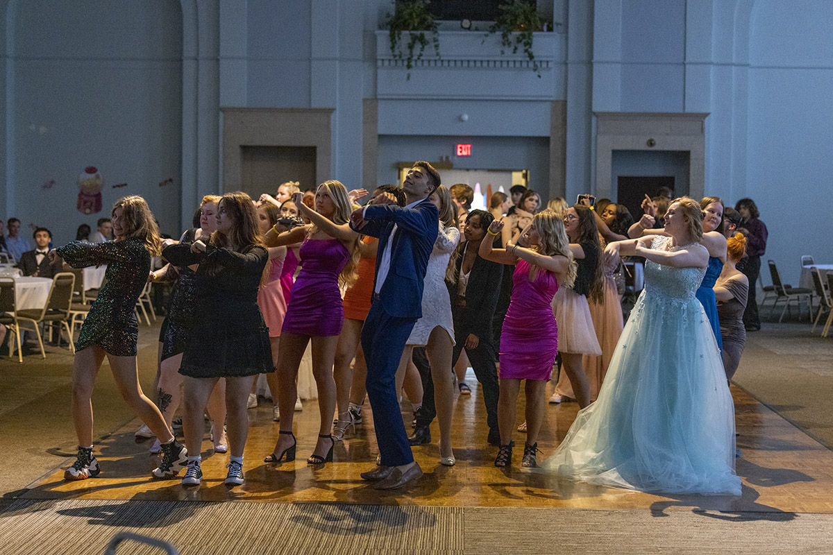 Students in formal wear dancing on the dance floor of the Northbank Ball ROom
