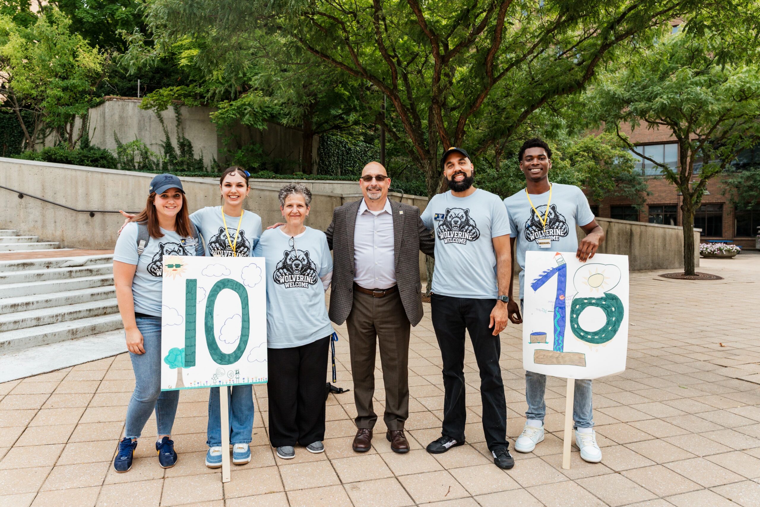Christopher Giordano poses with students and staff.