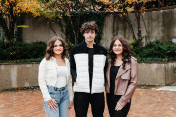 The Jarbou siblings stand in McKinnon Plaza