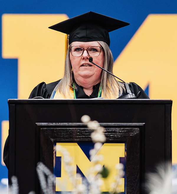 Angela Diemer speaking at the Podium